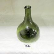 An antique 'onion' bottle marked G & G on base