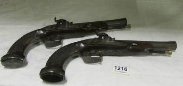 A pair of fine duelling pistols later converted to percussion