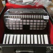 A cased Chanson Accordian