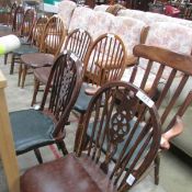 An elbow chair, 2 wheelback chairs and 7 stick back chairs