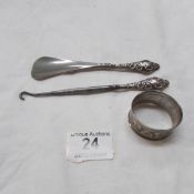 A silver handled button hook and shoe horn together with a silver napkin ring