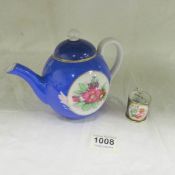 A Russian hand painted teapot a/f and a miniature 19th century tankard