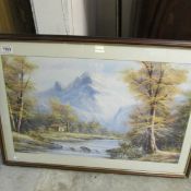 A framed and glazed mountain scene