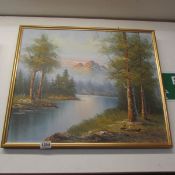 An oil on canvas 'River with mountain in background' signed G Whithan