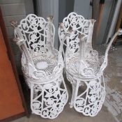 4 cast metal garden chairs