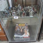 A Star Wars hand painted lead official figurine collection together with magazines