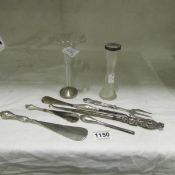 A mixed lot including silver handled shoe horns, button hooks, vases etc
