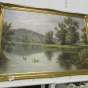 A gilt framed swans on lake scene