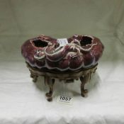 A Chinese bowl decorated with dragons and on wooden stand, a/f