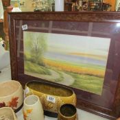 A framed and glazed watercolour landscape signed Nick Grant