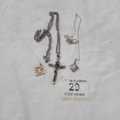A silver Crucifix, 2 silver pendants and 2 unmarked white metal chains