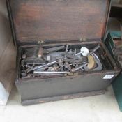 A wooden tool box and tools