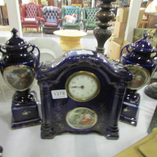 A 3 piece ceramic clock garniture