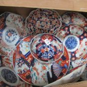 A box of Oriental plates and dishes