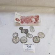 A small quantity of silver coins and a 10/- note