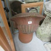 A terracotta garden urn