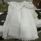 A linen Christening gown and one other