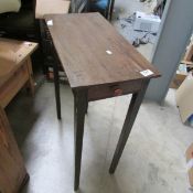 An occasional table with drawer