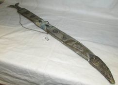 An ornamental sword in decorative scabbard