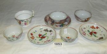 4 Chinese tea bowls, 3 saucers and a teacup
