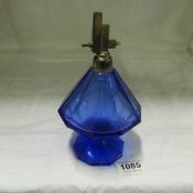 A large Art Deco blue glass perfume bottle