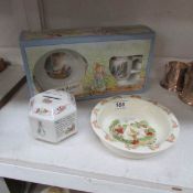 A Wedgwood Peter Rabbit money box, 2 piece Christening set and a Bunnikins bowl