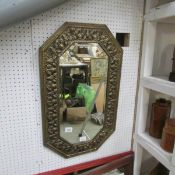 A gilt framed octagonal mirror