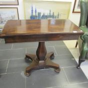 A Victorian rosewood fold over table