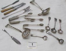 A mixed lot of EPNS including sugar tongs, ladles, sifter spoon etc