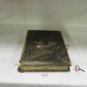 A Victorian musical photo album (spine distressed), in working order