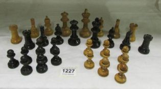A set of old weighted chess pieces