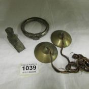 An Indian bracelet, A pair of miniature cymbals and a circa 16C Buddha foot