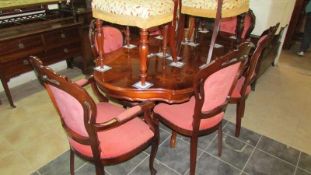 An Italian dining table and 6 chairs
