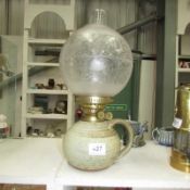 A studio pottery Duplex oil lamp with acid etched shade