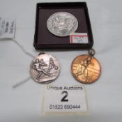 A Festival of Britain crown, a silver football medallion and a bronze boxing medallion
