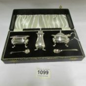 A cased silver plated condiment set
