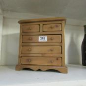 A miniature pine 2 over 3 chest of drawers