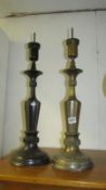 A pair of Eccliastical brass candlesticks