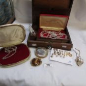 A mixed lot of costume jewellery in a writing box