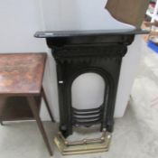 A brass fire front and a bedroom fire surround