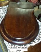 A Victorian mahogany toilet seat with brass fittings