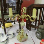 An ornate onyx candelabra table lamp