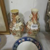 A pair of 19th Century figural Satsuma vases