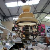 A ceiling light in the form of a hanging oil lamp