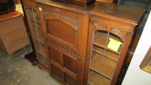 An oak bureau bookcase (glass a/f)