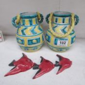 A pair of Italian pottery vases and a set of 3 graduated fish