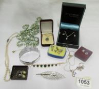 A mixed lot of necklaces, pendants, earrings and brooches