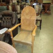 A cane backed arm chair