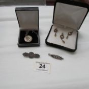 2 Victorian silver brooches, a silver St. Christopher and a silver pendant with matching earrings