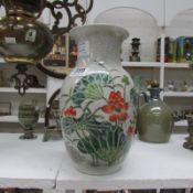 An Oriental vase with floral decoration